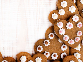 Heart shaped cookies on white wooden background