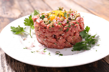 raw minced beef with egg and herbs