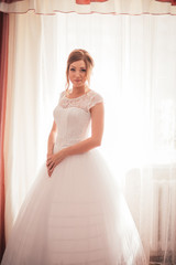 portrait of a young bride on a light background