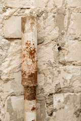 rusty water pipe after thirty years of operation. Corrosion inside a pipe. Water filter. Replacement of water supply. Repair in a bathroom. Old pipes of communications. Need to clean a tap water