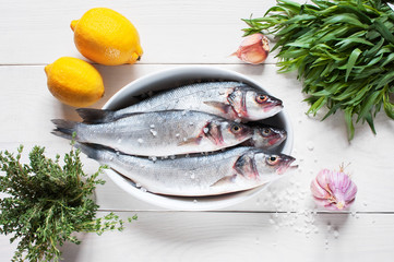 Raw fresh fish on the wooden table