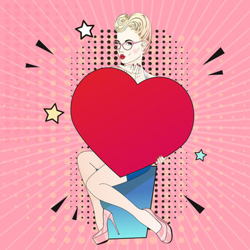 Comic Pop art blonde hair woman in pink labutenes sits and holds a red heart and send an air kiss. Vector illustration.