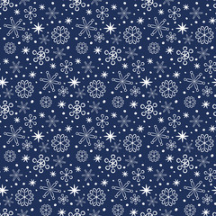 Seamless pattern with snowflakes on the blue background.