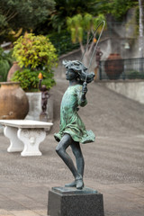  Statue of the girl with the skipping-rope in botanical garden Monte of Funchal, Madeira. Portugal
