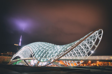 The Bridge of Peace over the Kura River in Tbilisi during twilight