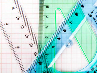 drawing tools on blue graph paper with copy space