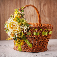 Fototapeta na wymiar Decorative Easter basket with flowers