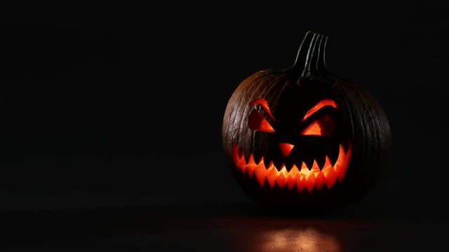Halloween pumpkin changes from day to night. 4k stop-motion animation.
