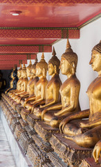 Reclining Buddha gold statue. Wat Pho, that famous and popular tourist attraction in Bangkok, Thailand, Southeast  Asia