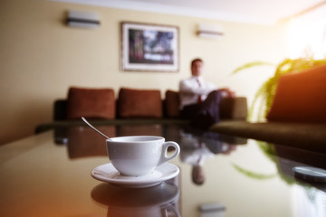businessman relaxes in his office after a Cup of coffee