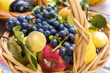knitted wooden basket full of fruit