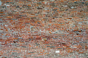 Old weathered red brick wall