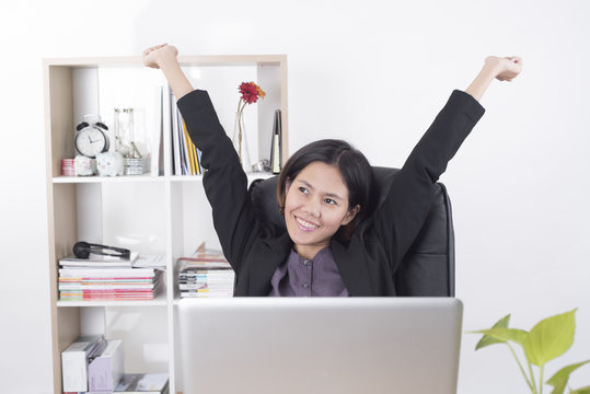 Business women working at office desk. she feels relax concept.