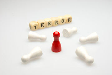 White and red ludo dice and word terror on white background
