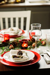 Table setting for celebration Christmas and New Year Holidays. Festive table at home with rustic details