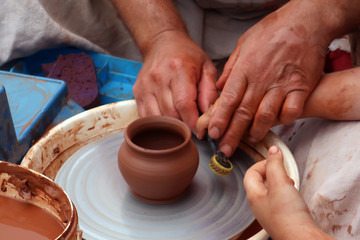 potter teaches his craft