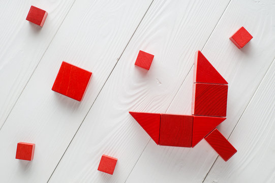 Red Wooden Blocks On White Wooden Background, Top View. Abstract Merger And Acquisition Business Concepts, Join Company.