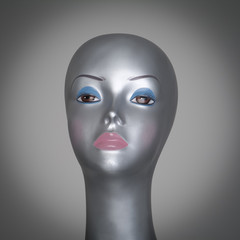 Silver mannequin head with makeup