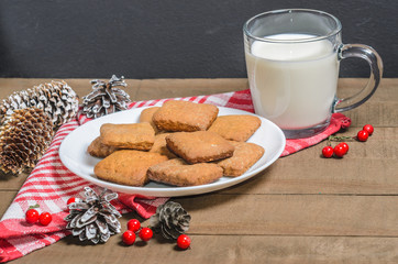 Biscuits, red berries, bumps, gifts, Christmas decor with free space for text. Top view