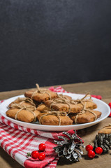 Biscuits, red berries, bumps, gifts, Christmas decor with free space for text. Top view