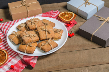 Biscuits, red napkin; gifts; Christmas decor with free space for text. Top view
