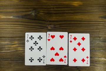 Playing cards on wooden background