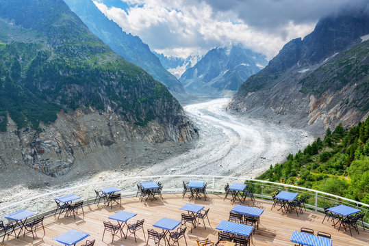 Panoramic cafe terrace with view on glacier Mer de Glace, in Chamonix Mont Blanc Massif, The Alps, France