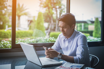 Businessman thinking plan all about money return on investment on chair in office with notebook