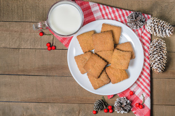 Biscuits, red berries, bumps, gifts, Christmas decor with free space for text. Top view