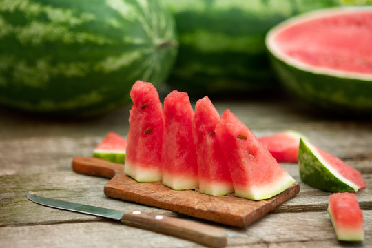 Watermelon slices on cutting board