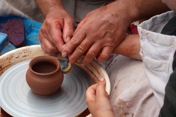 potter teaches his craft