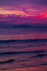 Fototapeta na wymiar Purple sunset in Sanya, Hainan, China. Colorful madness from the clouds, merging with the sea.