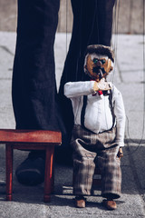 funny handicraft puppets drinking beer street art .