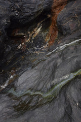 Eroded slate Tregardock Beach Cornwall