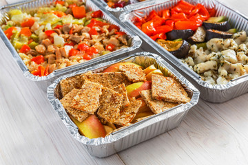 Healthy food take away, top view at wood background