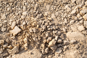 A background of sand and pieces of clay