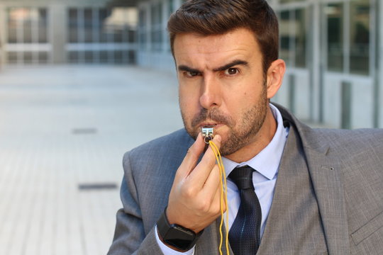 Businessman blowing a white isolated