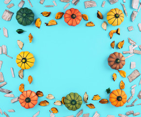 Decorative pumpkins on blue background.