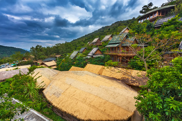 Wooden bamboo houses in the jungle. Sanya Li and Miao Village. Hainan, China.