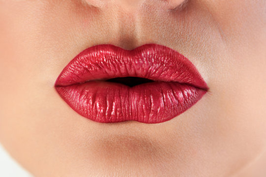 Passionate red lips pucker up