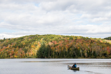fishing in a canoe in autumn colors