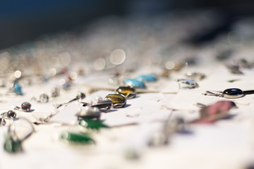 Exhibition of products from precious stones. Products from precious stones - bracelets, chains, pendants, earrings, necklace, rings