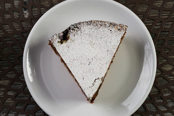 Slice of homemade cranberry pie cake with walnuts