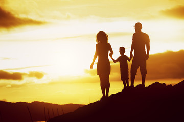 Family son sunset silhouettes sky