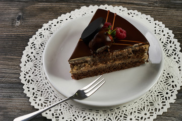 Slice of chocolate cake with chocolate cream