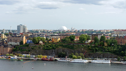 Fototapeta premium Globe arena, pier with boats and cityscape from the observation deck of Town Hall, Stockholm, Sweden