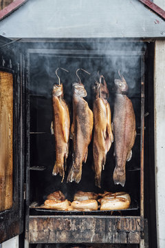 Food: Salmon trout and salmon being smoked in an oven