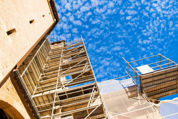 Scaffolding . Reconstruction of a high-rise historic building.