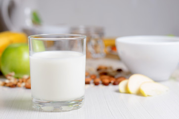 Obraz na płótnie Canvas Healthy Breakfast. Milk in a glass. Fruit, nuts