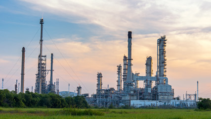 Oil refinery, petroleum and energy plant at twilight with sky background.  Industry Concept
